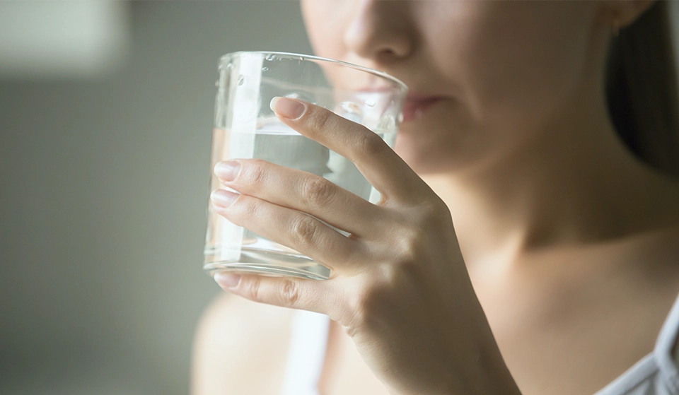 A person drinking water.